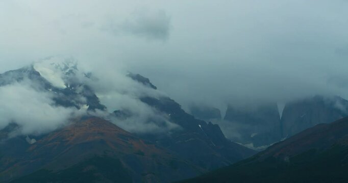 Dense clouds, rocks and mountain range, Torres del Paine National Park, Patagonia, Chile, South America