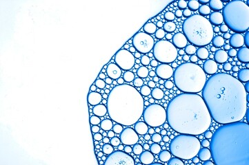 Oil bubbles in a molecular abstract in blue