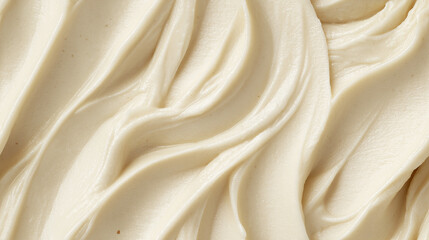 Obraz premium a close-up, top-down view, texture background of almond puree filling the frame with its pale beige color and silky texture