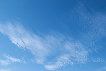 gentle white clouds in the blue sky