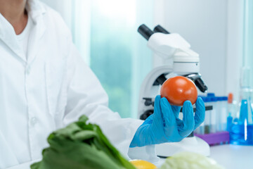 Scientist check chemical food residues in laboratory. Control experts inspect quality of fruits,...