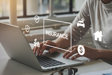 Professional Exploring Insurance and Finance Concepts on Laptop at Workspace