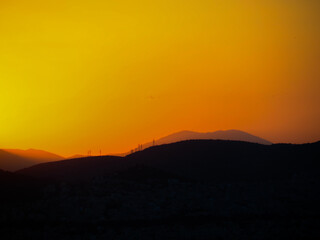 beautiful sunset in the mountains with vivid colours on a clear day