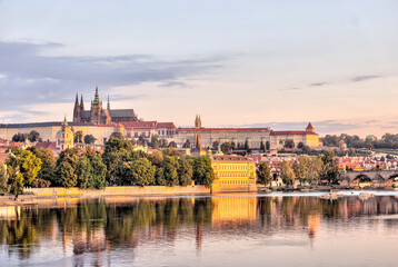 Prague, Czech Republic - July 19, 2024: Early morning views of the Vltava River and the Charles Bridge in Prague in the Czech Republic
