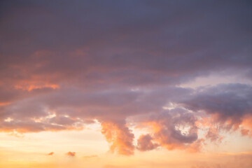 Beautiful sunset sky with vibrant colors and scattered clouds.