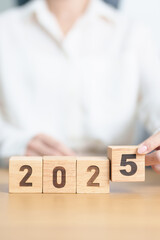 2025 year calendar block on table. goal, Resolution, strategy, plan, start, budget, mission,...