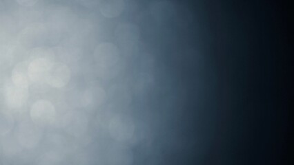 The movement of white bokeh against a dark background creates beautiful gradients of black, white and gray tones.