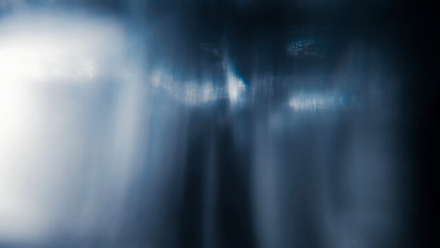 The movement of white bokeh against a dark background creates beautiful gradients of black, white and gray tones.