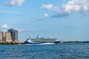 Cruise ship sailing near Manhattan in New York. Skyline of New York Manhattan cruising on the Hudson River cruise liner. Cruise vacation in New york