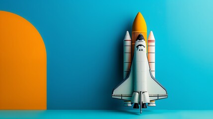 Obraz premium A toy space shuttle with a launch tower on a blue and yellow background