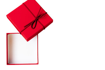 The red gift box opens isolated on white. Shot with a high angle of view. the open gift box with...