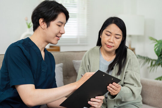 Healthcare Professional Conducting Home Visit with Patient, Providing Personalized Medical Care in a Comfortable Home Environment