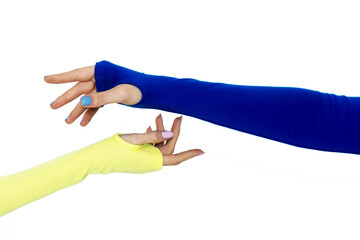 Intertwined hands with blue and yellow sleeves, concept of freedom of Ukraine