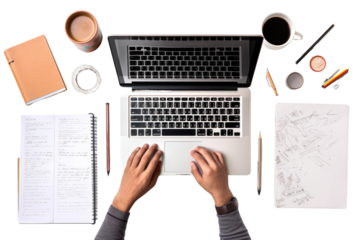 Overhead view of a student workspace with an open notebook, a laptop, isolated on white background