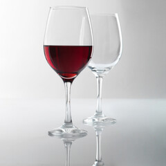 red wine glasses and wine glasses on light background