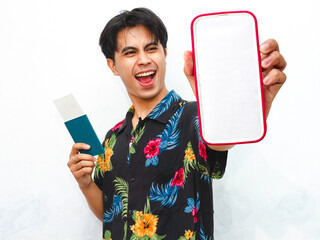 Portrait of Young asian man wear summer casual clothes holding pasport and showing blank mobile...