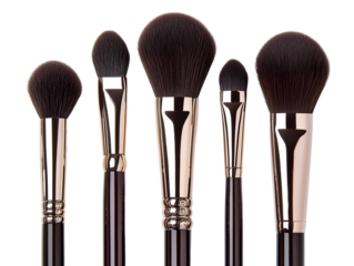 A set of professional makeup brushes with soft bristles on a white isolated background.