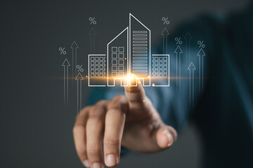 Real estate investment concept, Businessman touching building icon for analyzing mortgage loan home and insurance real property mortgage. interest rate, Investment planning, business real estate.