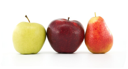 Red apple, green apple, and pear fruit trio on white background