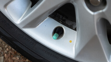 close up of a car tire valve
