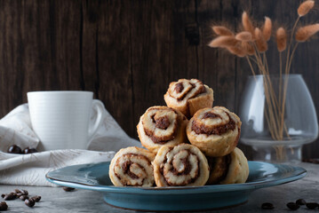 Plate with Cinnamon Rolls and Chocolates