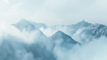 Serene Misty Mountains with Soft Cloud Cover