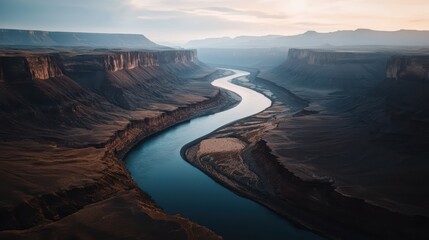 Serene river winding through majestic canyon landscape
