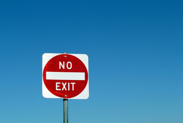 No Exit road traffic sign against a clear blue sky