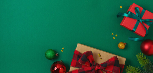 Merry Christmas and New Year background with gift box, decorations and ornaments. Top view, flat lay