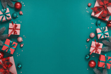 Christmas and New Year border frame with gift box and decorations on green background. Top view, flat lay