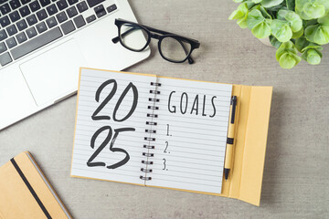 New Year 2025 goals and resolution business concept with notebook, laptop computer and plant on...