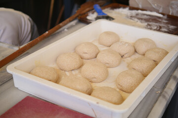 Deliciously Freshly Prepared Dough Balls on a Bakery Counter Ready for Baking and Enjoying