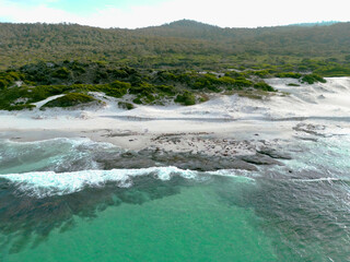 Aerial views over white sandy beach in Tasmania, Australia