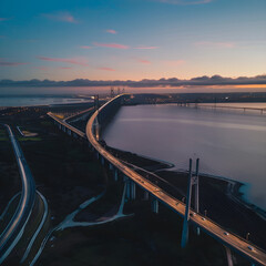 Vasco da gama bridge connecting lisbon to almada at sunset