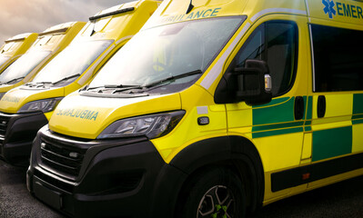 Ambulances - emergency services ambulance vehicles on standby.  The medically equipped transport...