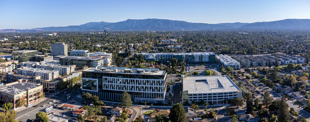 Aerial view of mixed use urban development - modern office buildings, stores, townhouses, apartment complexes along Winchester Blvd in San Jose, California