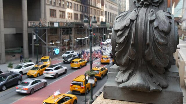 New York City Grand Central Terminal railway station, 42 street. Manhattan Midtown. Yellow taxi cab row, car transport and Pershing Square bridge, NYC, USA. American road traffic, people pedestrians.