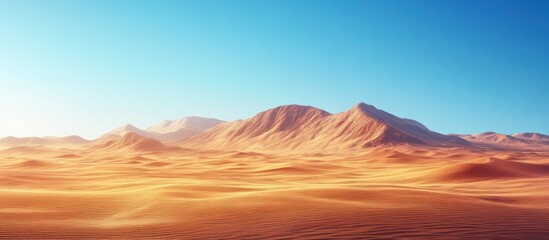 A vast, golden desert stretches out before a range of red mountains under a clear blue sky.