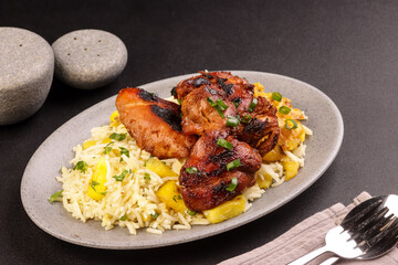 Huli-Huli Chicken is Hawaiian Grilled Chicken Infused with Sweet and Tangy Marinated from Pineapple, Served with Rice. 