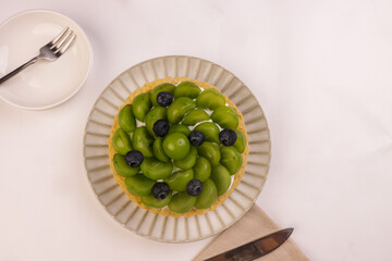 Shine Muscat Grape Tart, Garnish with Blueberry.