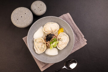 Tteok Mandu Guk is Korean Dumpling and Rice Cake Soup for New Year Celebration.
