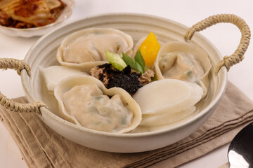 Tteok Mandu Guk is Korean Dumpling and Rice Cake Soup for New Year Celebration.