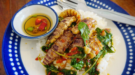 Stir-fried Mantis shrimp with basil top on rice, Seafood Thai style cuisine