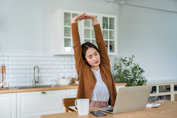 Office syndrome concept. Young asian woman feeling pain in neck and shoulder after working on...