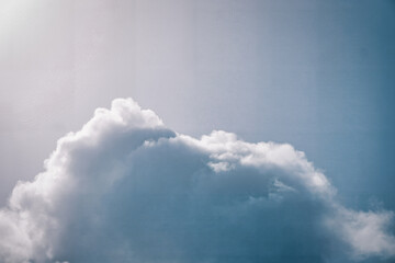 Quiet Sky: Soft, Fluffy Clouds Sailing in Calm Blue.