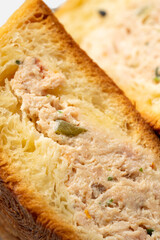 Close-up of croissant onigiri dessert  cut in half and isolated on white background