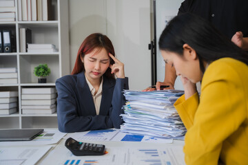 Overwhelmed with Work: Stress and frustration in the office, a visual representation of the pressure and workload facing business professionals in a modern office.
