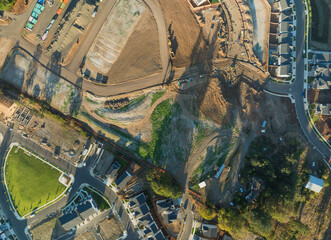A view of a residential area with houses and a park