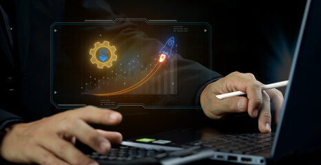 Business concept, an organization or enterprising entity engaged in commercial, industrial, or professional activities. Businessman using computer to show neon line of Business icon on virtual screen.