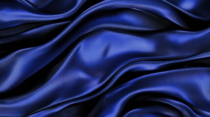 Fototapeta premium Luxurious blue satin fabric with soft, flowing folds creating a smooth and glossy texture, ideal for backgrounds, fashion, or textile design projects